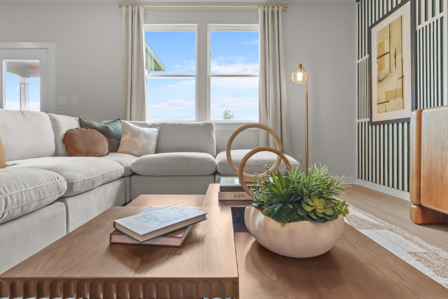 A living room with a table and chairs.