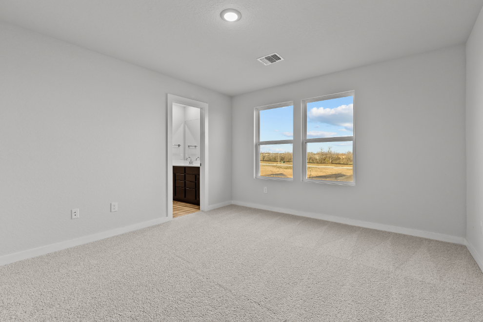 A room with a window and a door.