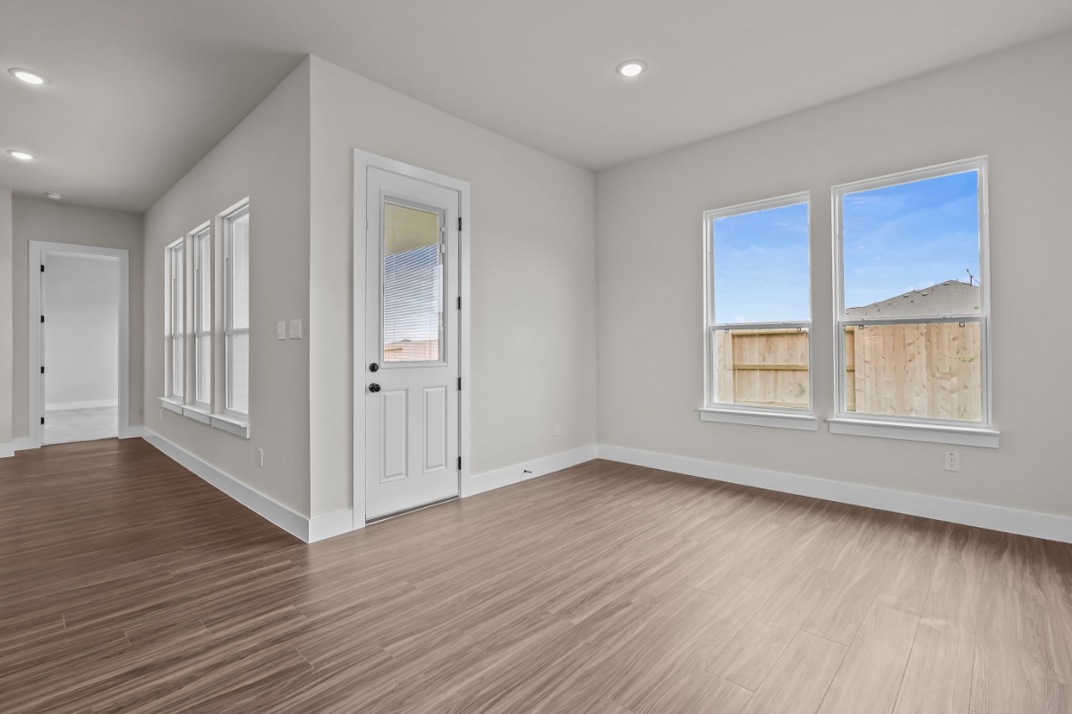 A room with white walls and windows.