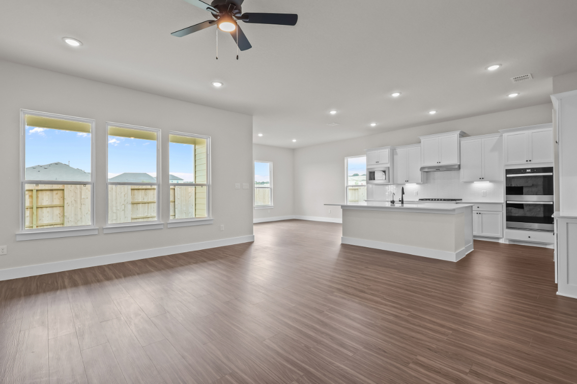 A large kitchen with white cabinets.