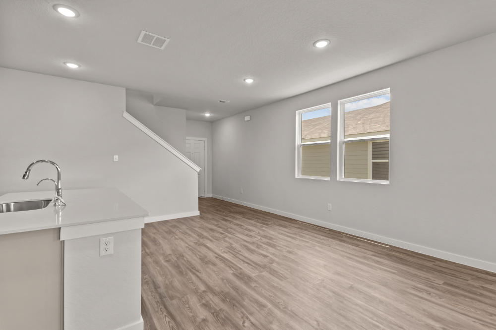 A bathroom with a sink and a window.