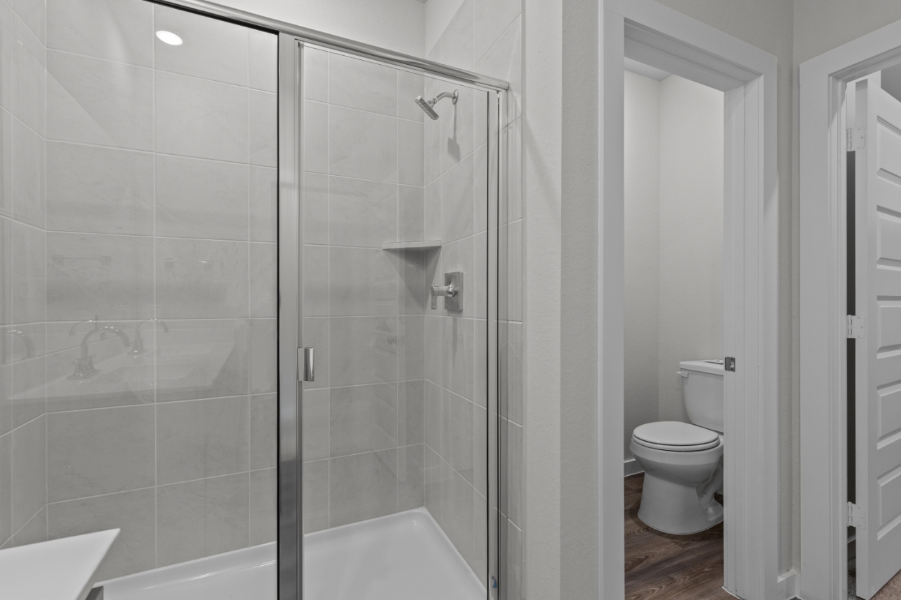 A bathroom with a glass shower.