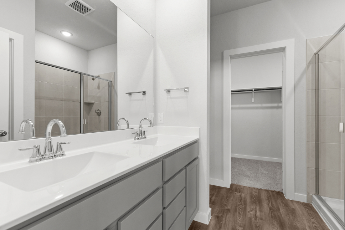 A bathroom with a glass shower.