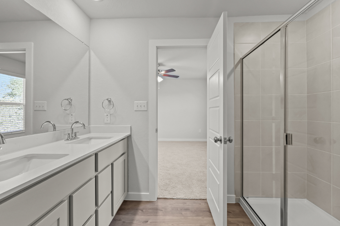 A bathroom with a glass shower.