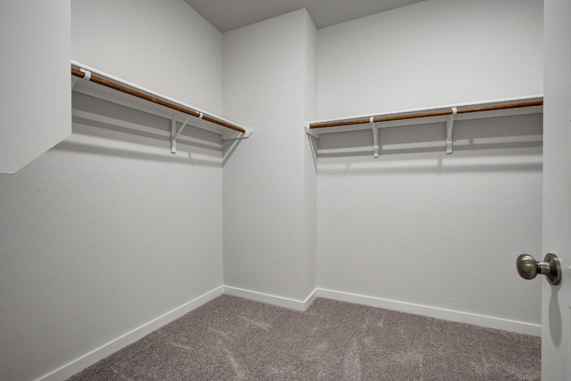 A white room with a white door.