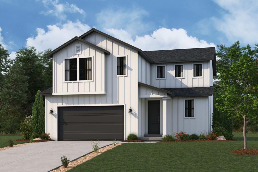 A white house with a garage.