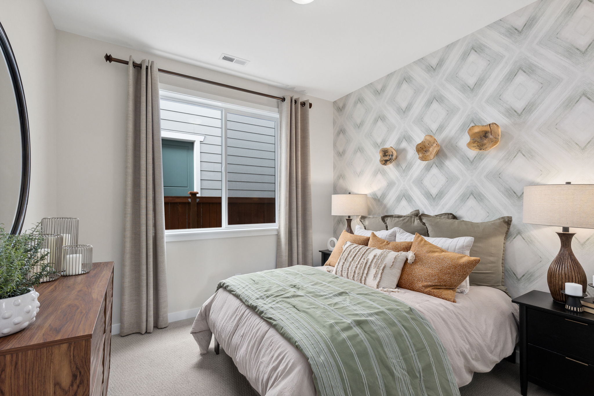 A bedroom with a bed and a window.