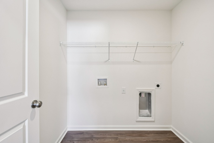 A white room with a metal bar.