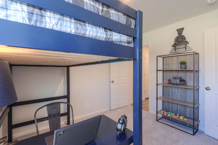A room with a table and shelves.