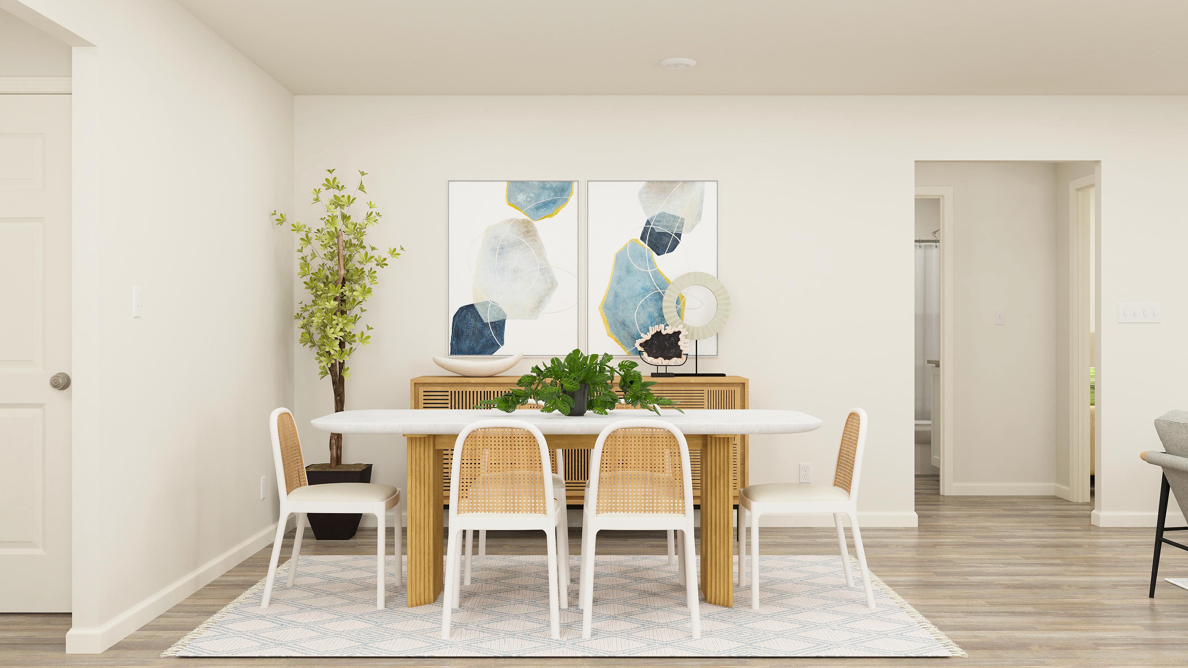 A dining room with a table and chairs.