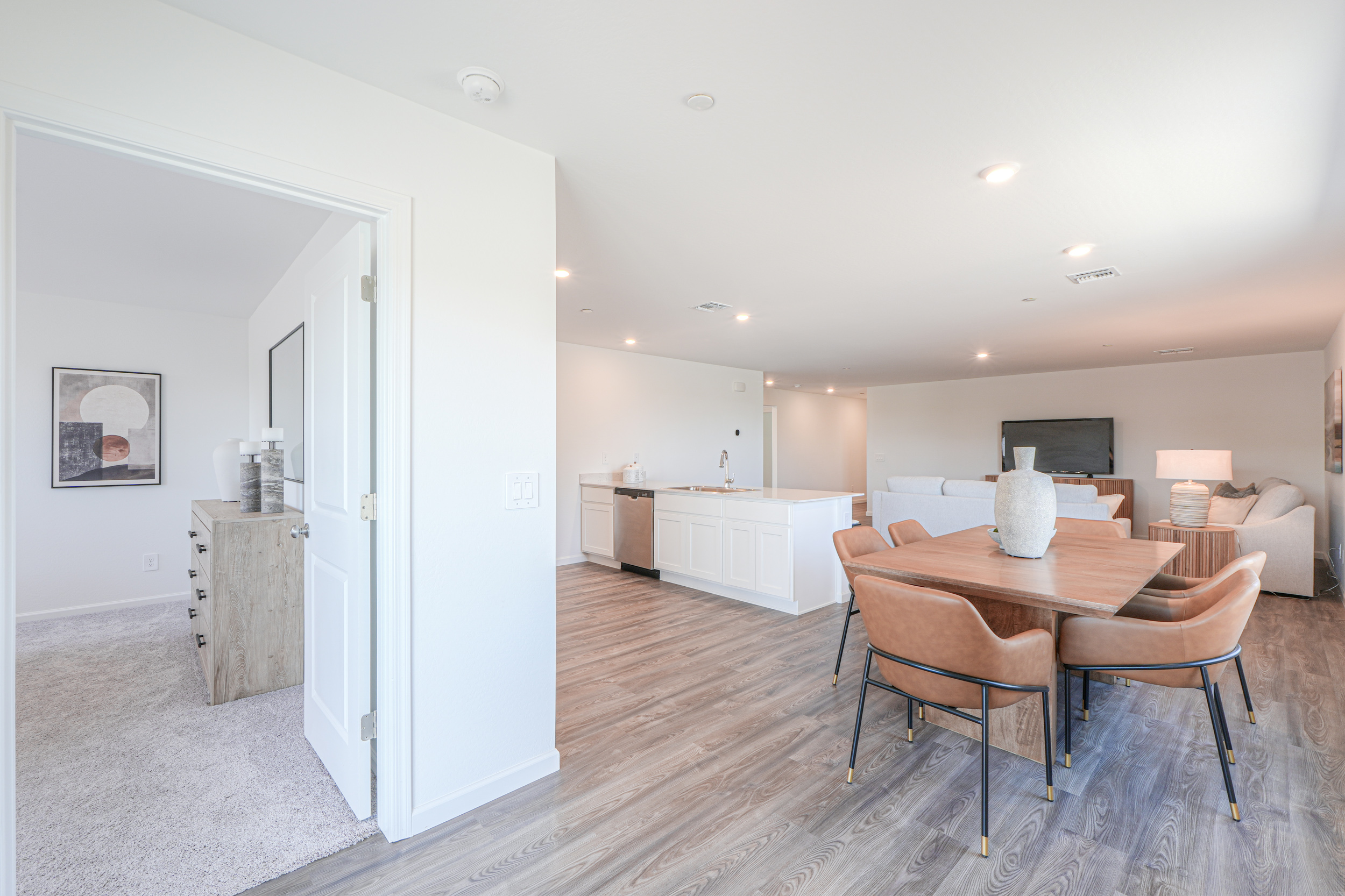 A room with a table and chairs.