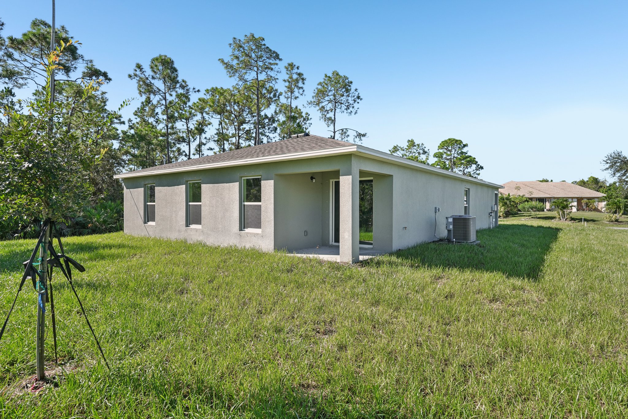 A house with a lawn in front of it.