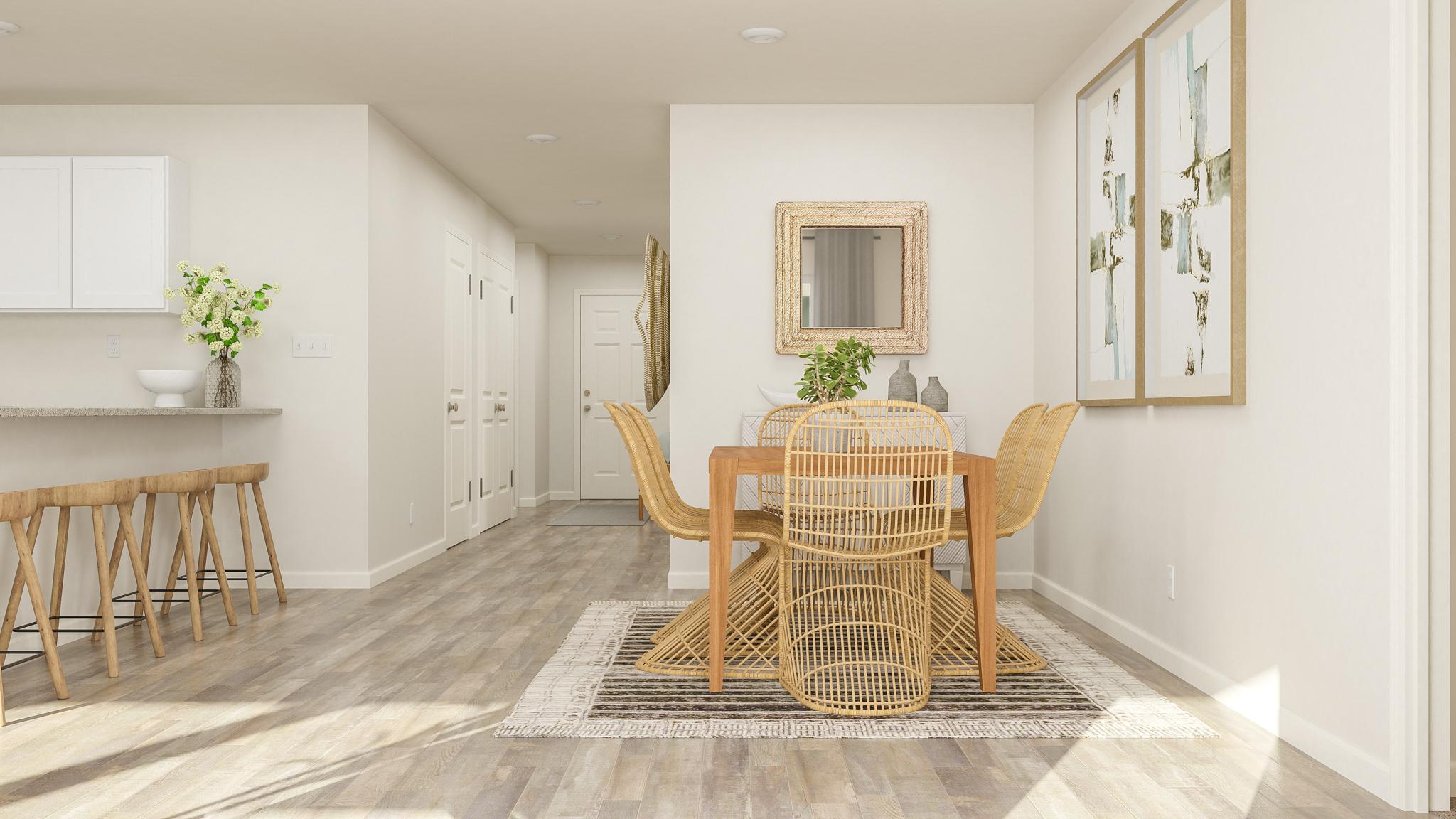 A dining room with a table and chairs.